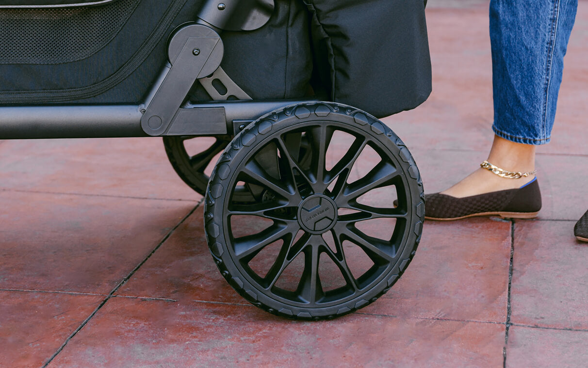 Close-up of an all-terrain L Series wheel on a tiled walkway