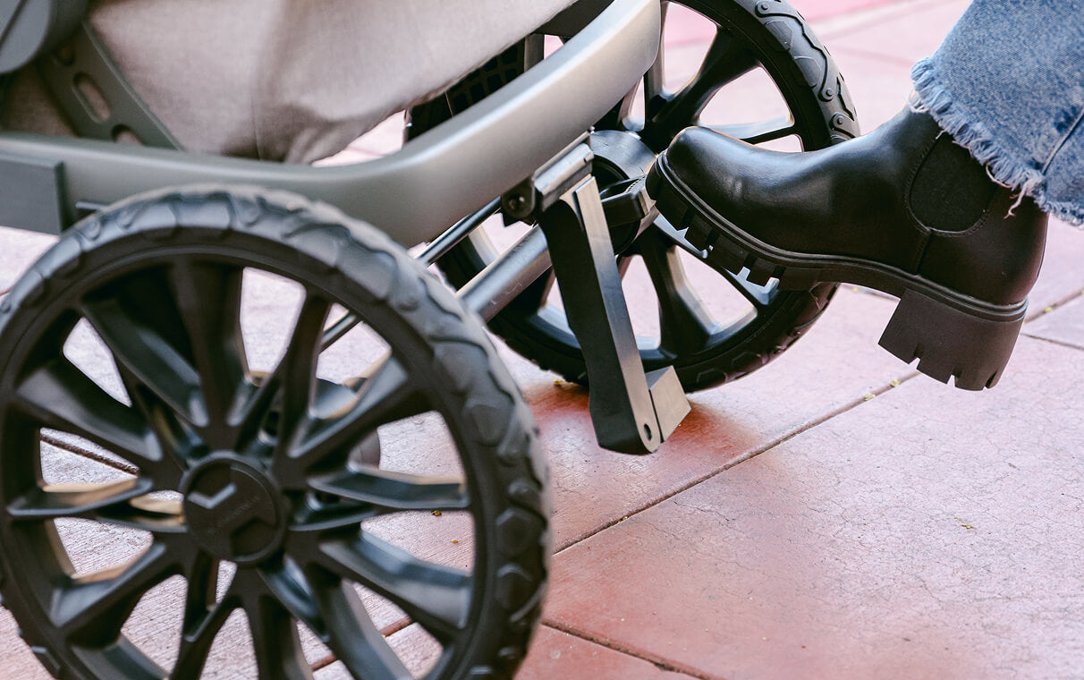 A foot pressing the one-step brake pedal on the L Series wagon