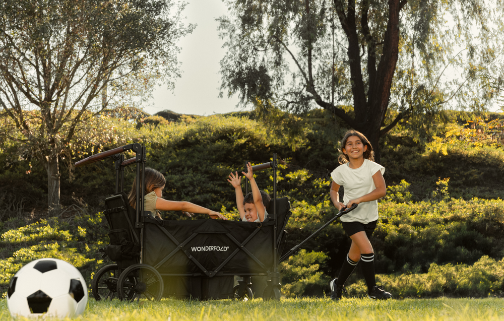 Children using the XR stroller wagon at soccer practice. 
